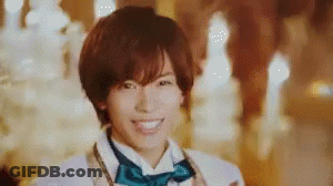 Young Man In Bow Tie And White Jacket Smiling GIF