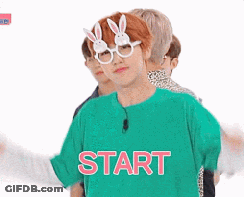 Young Man In Bunny Glasses And Green Shirt Saying Start GIF