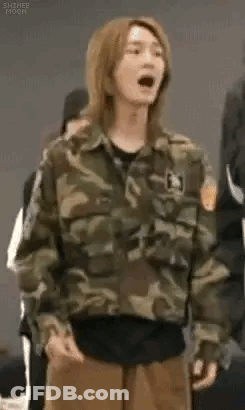 Young Man In Camouflage Jacket With Mouth Open GIF