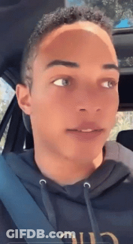 Young Man In Car Wearing Black Hoodie Saying Chic GIF