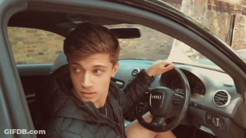 Young Man In Car With Audi Logo GIF