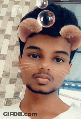 Young Man In Cat Mask With Bubbles Coming Out Of Ears GIF