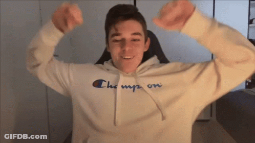 Young Man In Champion Hoodie Flexing GIF