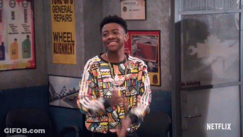 Young Man In Colorful Adidas Shirt At General Repairs Sign GIF