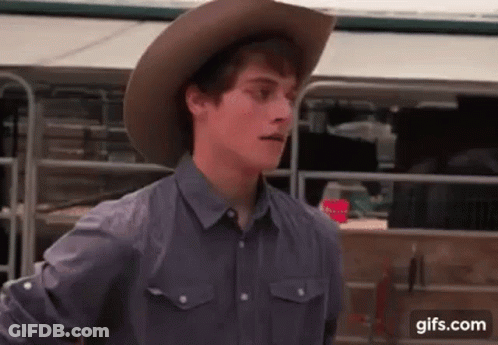Young Man In Cowboy Hat And Gray Shirt GIF
