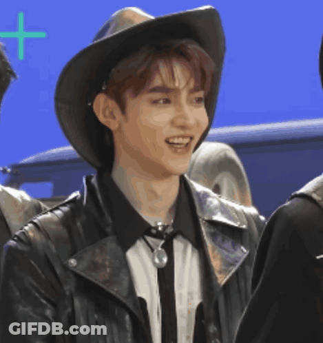 Young Man In Cowboy Hat And Leather Jacket Smiling GIF