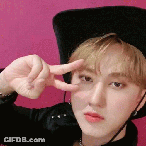 Young Man In Cowboy Hat Giving Peace Sign GIF