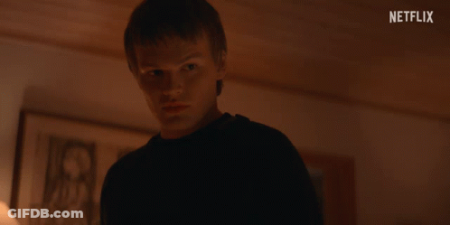 Young Man In Dark Room Netflix Logo GIF