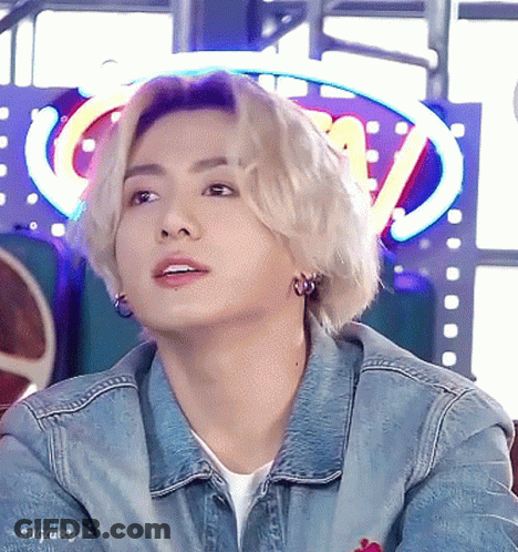 Young Man In Denim Jacket And Earrings GIF