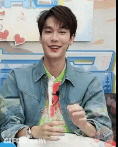 Young Man In Denim Jacket And Green Shirt GIF
