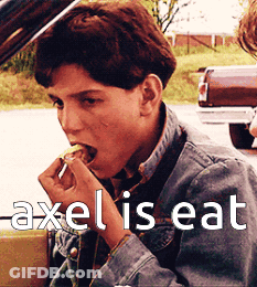 Young Man In Denim Jacket Eating GIF