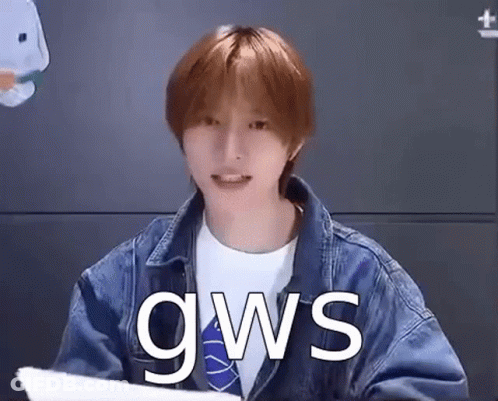 Young Man In Denim Jacket Holding Paper GIF