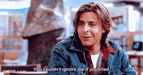 Young Man In Denim Jacket Talking To Someone GIF