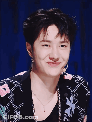 Young Man In Floral Jacket And J Necklace GIF