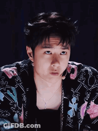 Young Man In Floral Jacket And Necklace GIF
