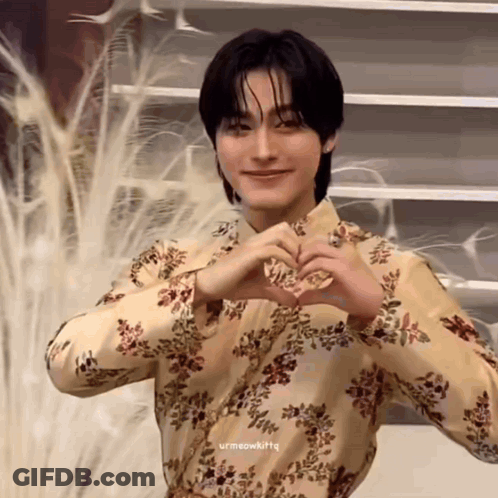 Young Man In Floral Shirt Making Heart With Hands GIF