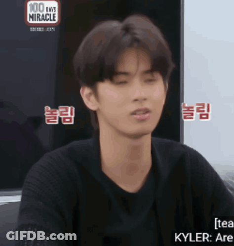 Young Man In Front Of 100 Days Miracle Screen GIF