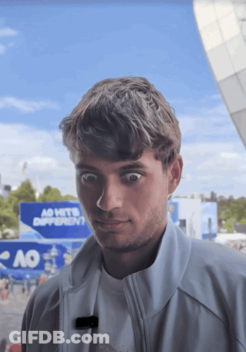 Young Man In Front Of Ao Sign GIF