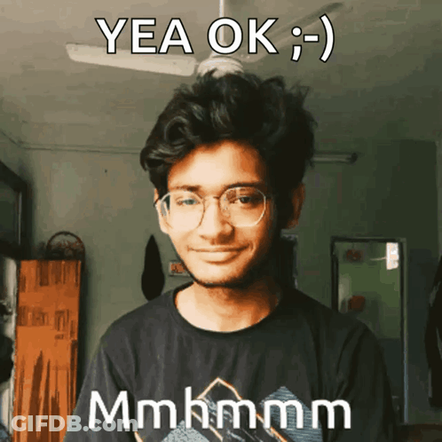 Young Man In Glasses And Black Shirt Saying Yea Ok GIF