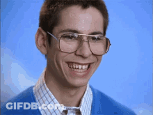 Young Man In Glasses And Blue Shirt Smiling GIF
