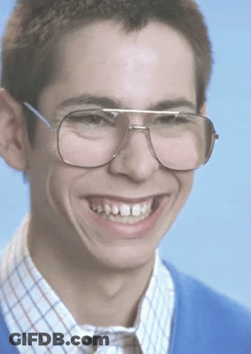 Young Man In Glasses And Blue Sweater Smiling GIF