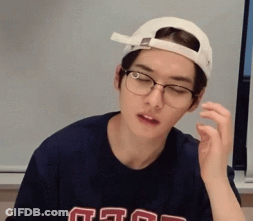 Young Man In Glasses And Cap Making Face GIF