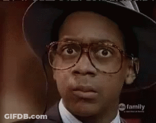Young Man In Glasses And Hat Making Face GIF