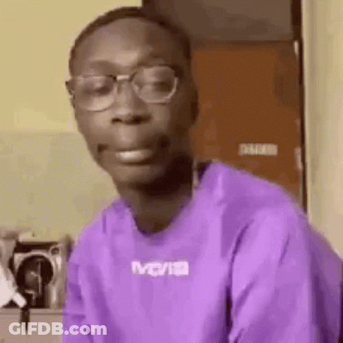 Young Man In Glasses And Purple Shirt Making Face GIF
