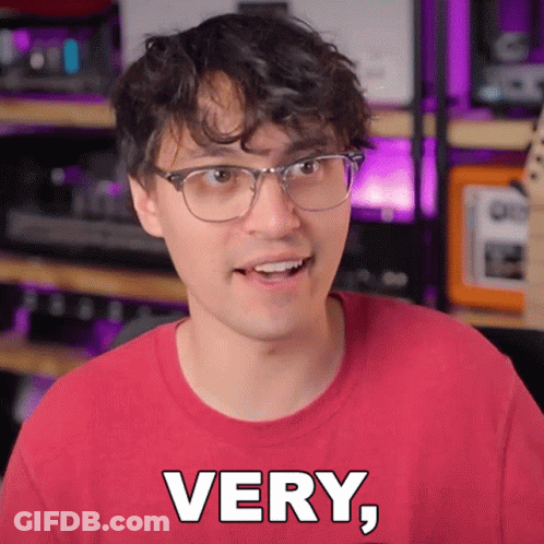 Young Man In Glasses And Red Shirt Saying Very GIF