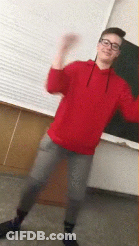 Young Man In Glasses And Red Sweatshirt Dancing GIF