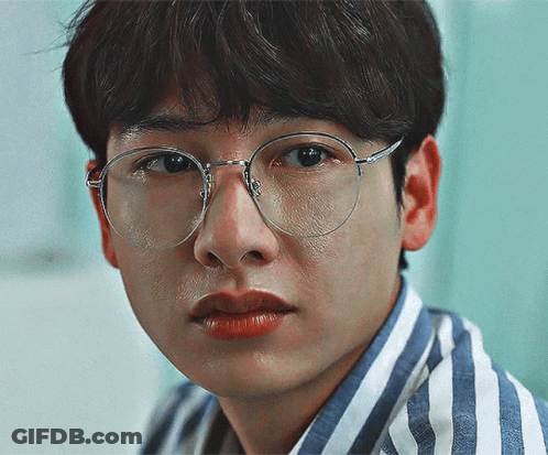 Young Man In Glasses And Striped Shirt GIF