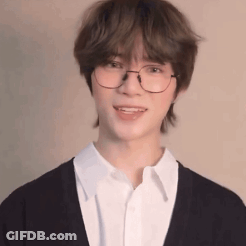 Young Man In Glasses And White Shirt Smiling GIF