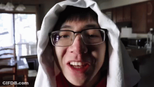Young Man In Glasses And White Towel Smiling GIF