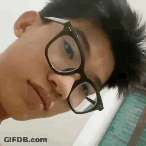 Young Man In Glasses Making Funny Face GIF