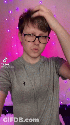 Young Man In Glasses Scratching Head GIF