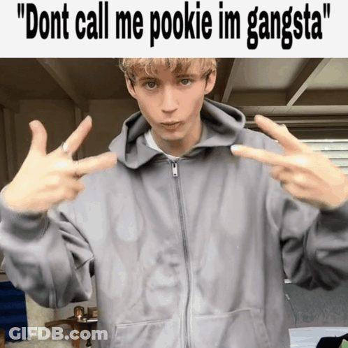 Young Man In Gray Hoodie Making Peace Sign GIF