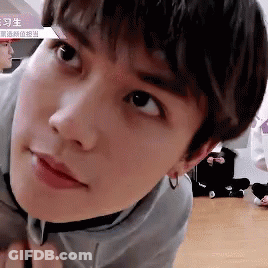 Young Man In Gray Shirt Close Up GIF