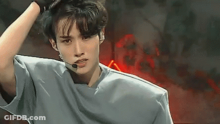 Young Man In Gray Shirt With Microphone GIF