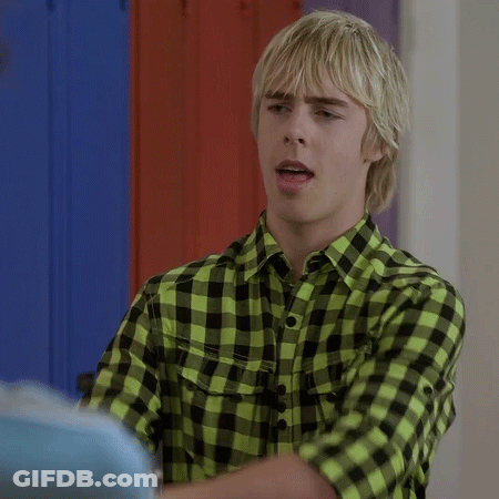 Young Man In Green And Black Plaid Shirt Talking GIF
