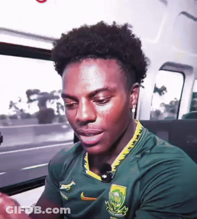 Young Man In Green Nike Shirt Sitting In Car GIF