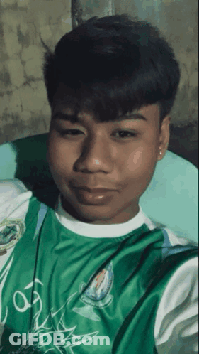 Young Man In Green Shirt Saying A GIF