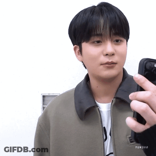 Young Man In Grey Sleeveless Shirt Making Heart GIF