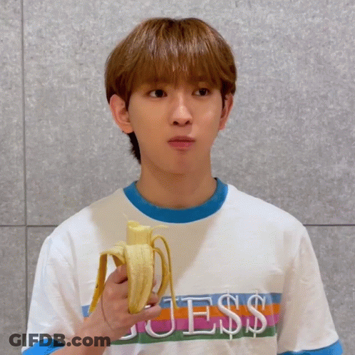 Young Man In Guess Shirt Holding Banana GIF