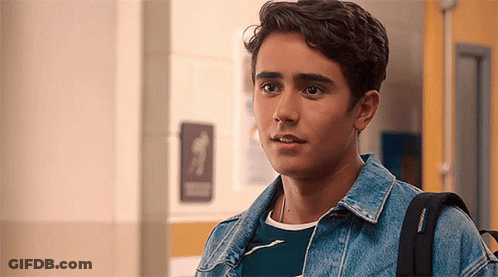 Young Man In Hallway With Backpack GIF