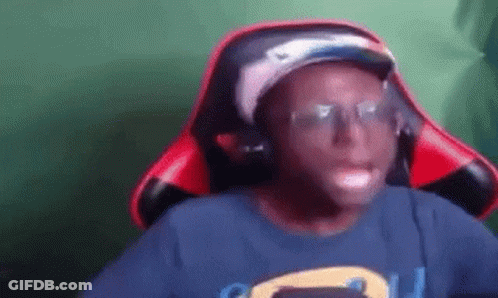 Young Man In Hat And Headphones Sitting In Chair GIF
