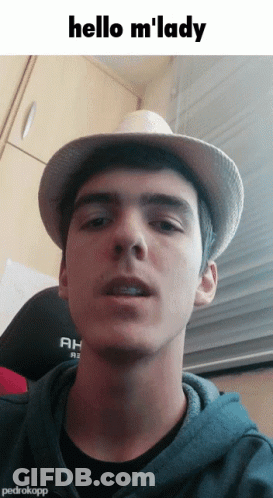 Young Man In Hat And Hoodie Says Hello M Lady GIF