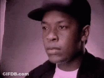 Young Man In Hat And Jacket Looking At Camera GIF