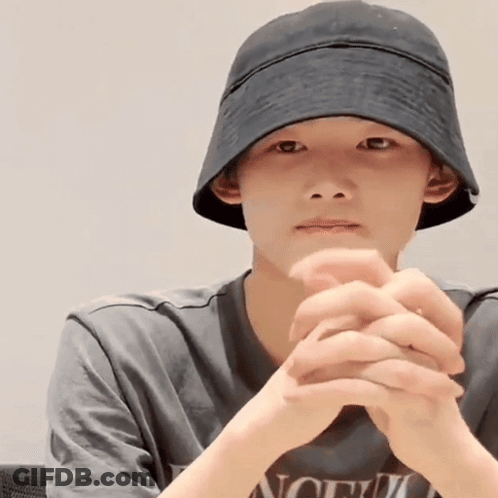 Young Man In Hat And T-Shirt With Word North GIF