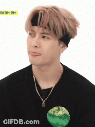 Young Man In Headband And Necklace Making Funny Face GIF