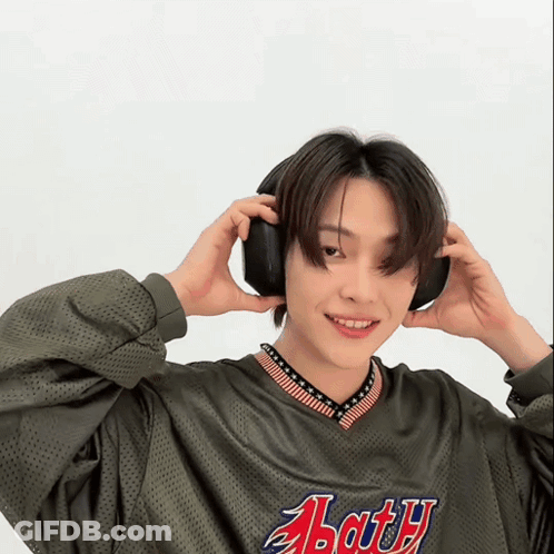 Young Man In Headphones And Abarth Jersey GIF